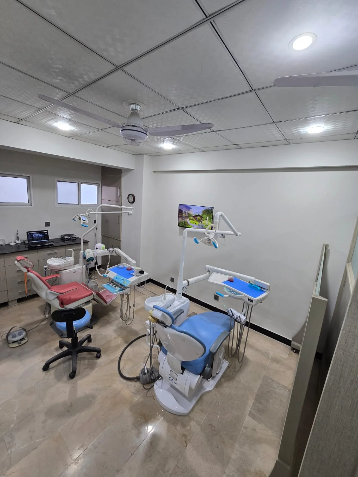 Family Dental Clinic treatment room with dental chairs and equipment