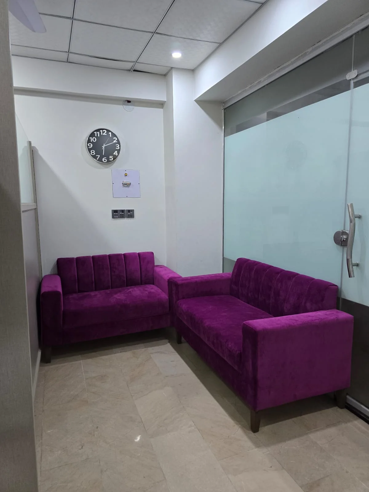 Purple seating in the Family Dental Clinic waiting area